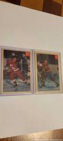 Both 1954-55 Parkhurst cards side-by-side in sleeves