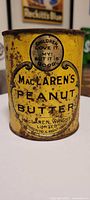 Front view of yellow MacLaren's Peanut Butter tin