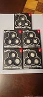 Five sealed BunMo Magnetic Fidget Rings 3-packs laid out