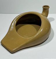 Top view of tan glazed ceramic bedpan chamber pot