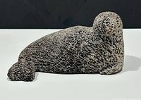 full side view of seal sculpture showing porous texture