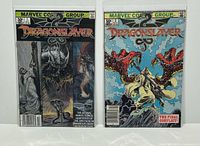 Front covers of Dragonslayer issues 1 and 2 in bags