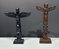Front view of both totem poles side by side