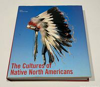 Front cover showing title and feathered headdress image