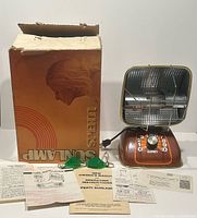 Sunlamp with box, goggles and paperwork laid out