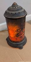 Lamp illuminated showing forest fire scene