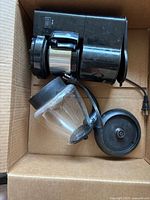 Coffee maker and kettle inside box