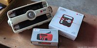 All three radios: boxed FR360, boxed FR150, loose beige radio