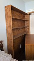 Full view of bookcase side profile showing depth and shelves