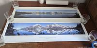Both panoramic prints laid flat, full view of images and borders