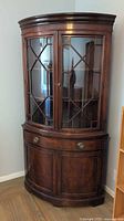 Full view of corner china cabinet showing overall design
