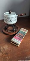 Complete fondue set showing pot on stand plus boxed forks