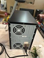 Rear view showing dual cooling fans, power supply and connectors