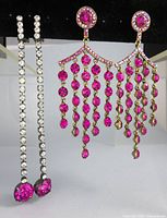 Kenneth Lane linear drop earrings and gold-tone chandelier earrings front view