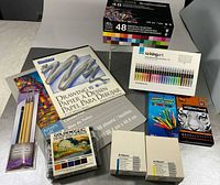 Full lot overview showing all boxed sets, pad and brushes