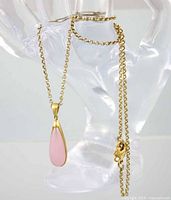 Full necklace draped to show pendant and chain