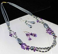 Full view of necklace with both pairs of matching earrings