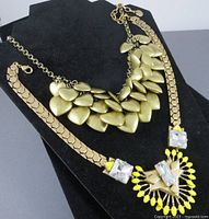 Both necklaces displayed on bust