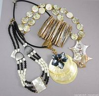 Group shot showing all three necklaces and bracelet