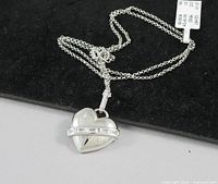 Close view of sterling silver heart pendant on chain