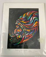 Front view of signed limited edition print in sleeve