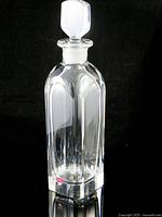 Full view of crystal decanter showing body shape and stopper