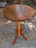 Full view of round pedestal side table outdoors