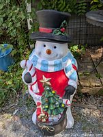 Full view of 38" snowman blow mold standing outdoors