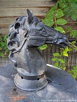 Front right view of cast iron horse head topper showing overall form and condition