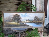 Full view of framed yard-long pastel landscape