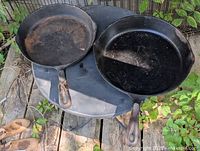 Top view of both cast iron pans to show design and size difference