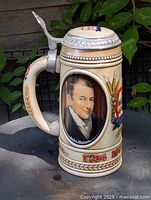Right side view showing portrait of John Molson, handle and lid