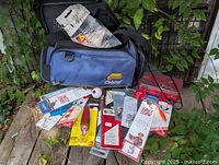 Overall lot with tackle bag, tackle box and packaged lures