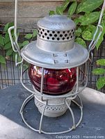 Front view of Adlake Kero lantern with red globe