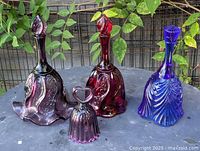 All four colored glass hand bells together