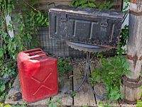 Jerry can and ammunition case together for scale and condition view