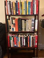 Full view of bookshelf loaded with books