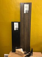 Two shelves, stack of pine brackets, several metal brackets