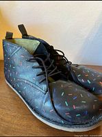 Side view of sprinkle-pattern leather ankle boots