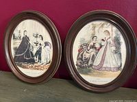 Both framed fashion prints side by side showing full view