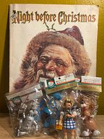 Book cover and three packaged ornaments