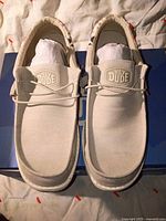 Top view of both Hey Dude shoes showing uppers and laces