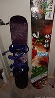 Both snowboards side by side showing length difference