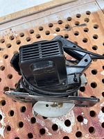 Top view of circular saw body, cord, base and blade guard