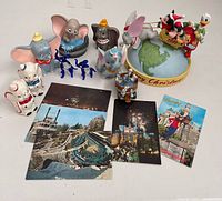 All Dumbo figurines, glass elephants and postcards group shot