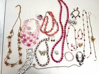 Full layout of all jewellery pieces on white background