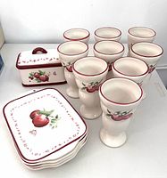 Full lot showing four plates, ten cups, and Kitchen Keeper