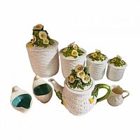 All items grouped: four canisters, teapot, Belleek pitcher, sugar and creamer