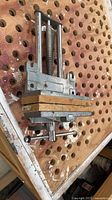 Top view of woodworking vise showing wooden jaw faces and quick-release mechanism