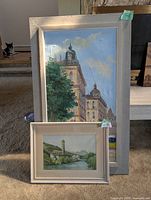 Both framed artworks showing relative sizes